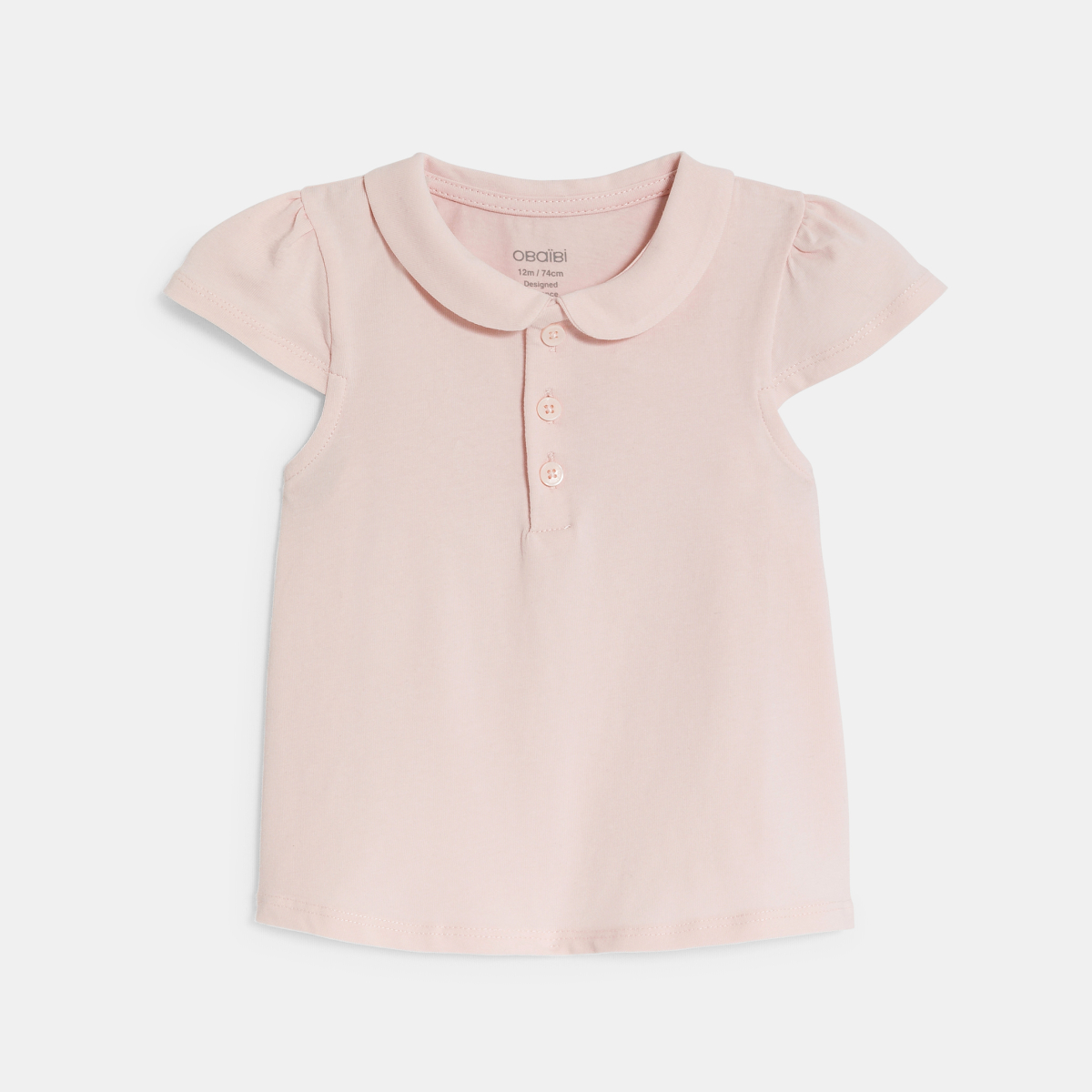 قميص بولو من القطن بياقة مستديرة، باللون الوردي للفتيات الصغيرات. قميص بولو من القطن بياقة مستديرة، باللون الوردي للفتيات الصغيرات.
