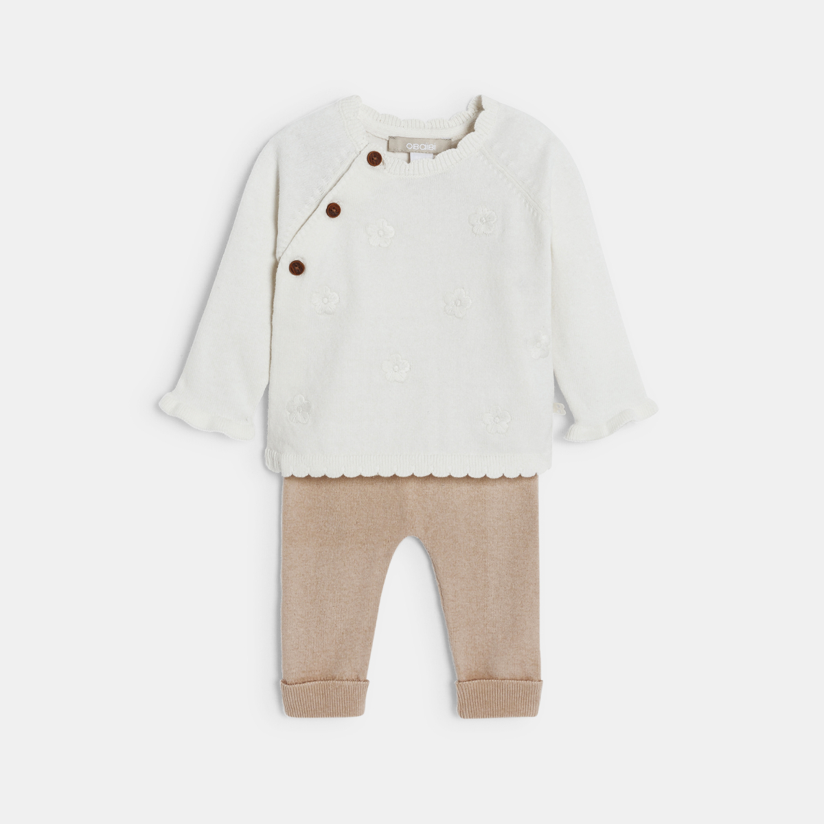 طقم للأطفال الصغار، منسوج بالتريكو، باللون البيج الفاتح. طقم للأطفال الصغار، منسوج بالتريكو، باللون البيج الفاتح.