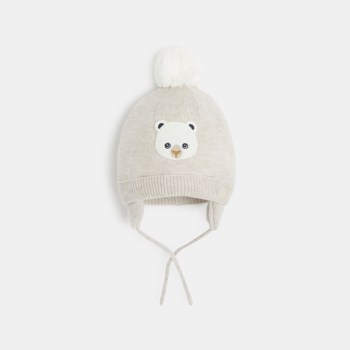 قبعة صوفية مبطّنة بالفرو الاصطناعي باللون البيج للأولاد الصغار قبعة صوفية مبطّنة بالفرو الاصطناعي باللون البيج للأولاد الصغار